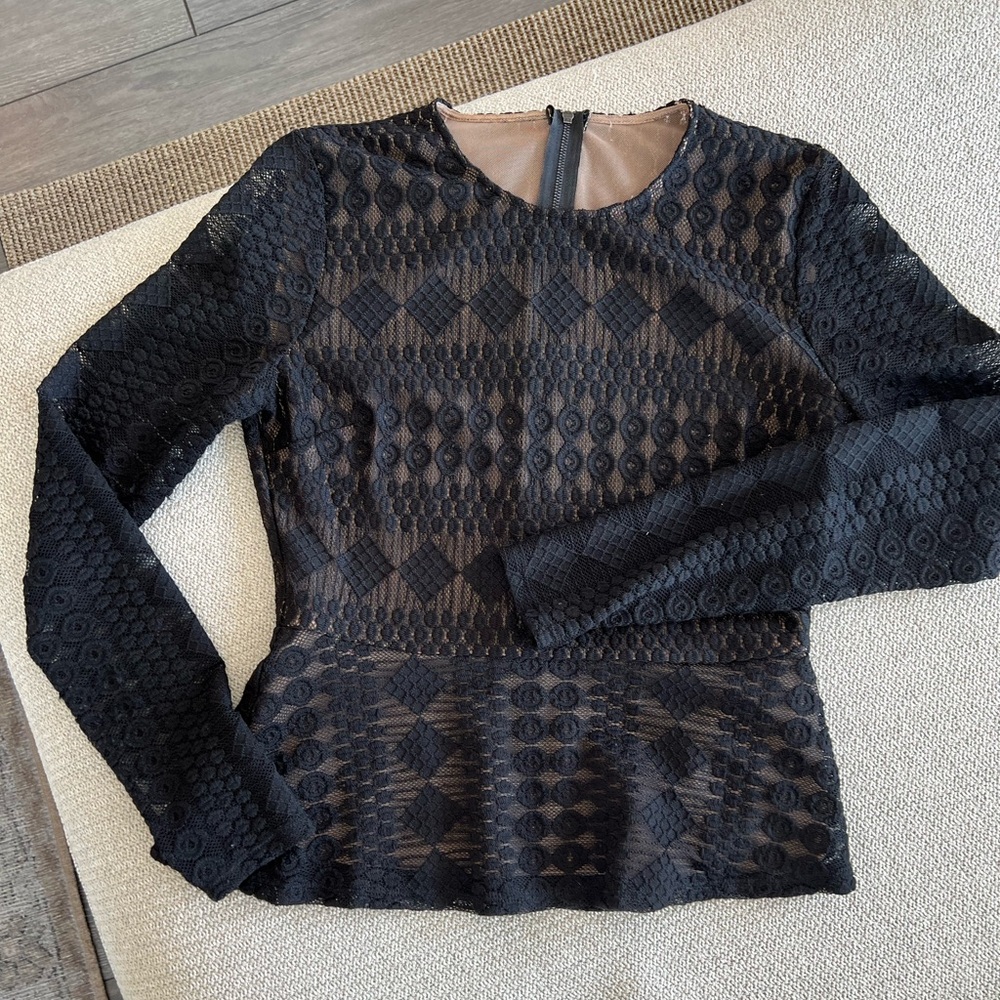 Women’s black lace long-sleeved peplum top. Size S